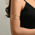Handcrafted Gold-plated Geometric Cuff Bracelets And Boho-chic Metal Tassel Arm Rings With Vintage-inspired Exaggerated Water Drop Designs, Offering Unisex Luxury Accessories In Open Bangle Styles - Norellé