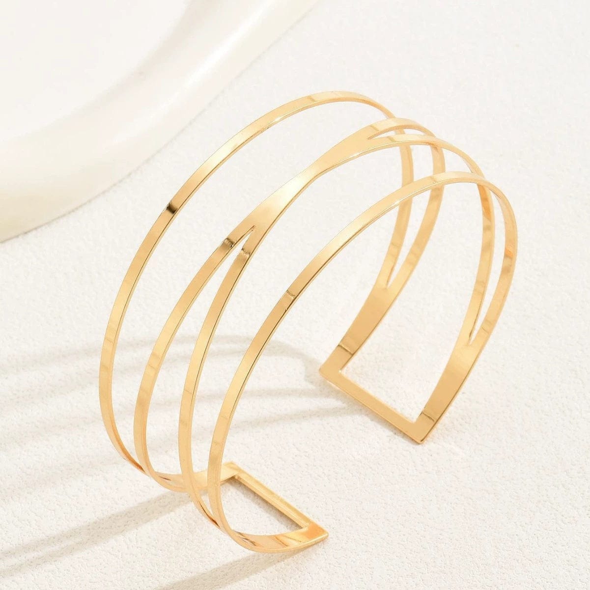 Handcrafted Gold-plated Geometric Cuff Bracelets And Boho-chic Metal Tassel Arm Rings With Vintage-inspired Exaggerated Water Drop Designs, Offering Unisex Luxury Accessories In Open Bangle Styles - Norellé