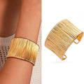 Handcrafted Gold-plated Geometric Cuff Bracelets And Boho-chic Metal Tassel Arm Rings With Vintage-inspired Exaggerated Water Drop Designs, Offering Unisex Luxury Accessories In Open Bangle Styles - Norellé