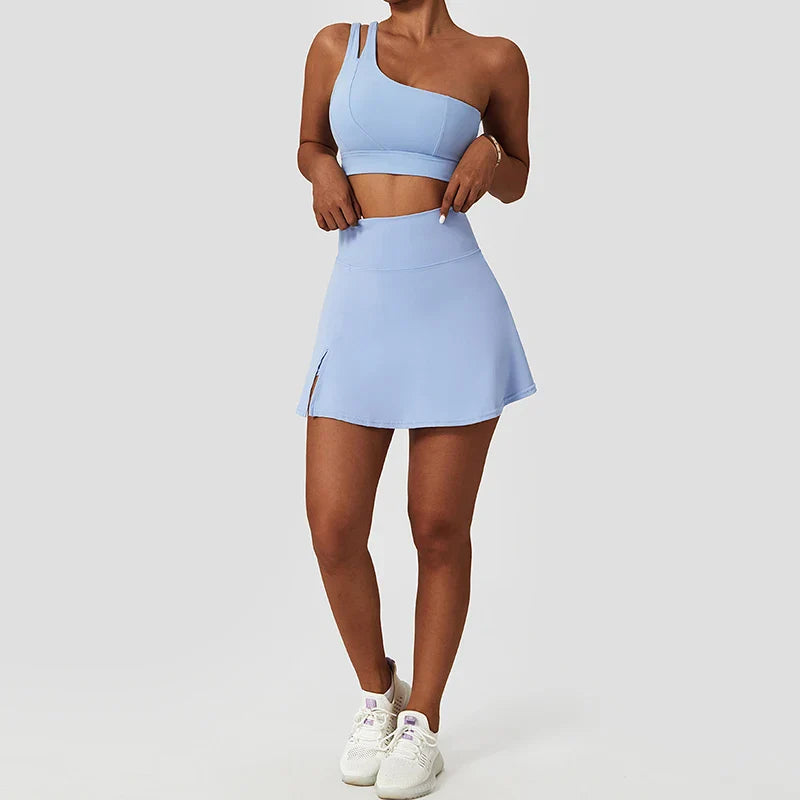 Light blue athletic skirt and one-shoulder crop top set from Black One-Shoulder Sports Bra and Leggings Tennis Suit for women
