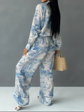 Blue and white toile print pajama set with lapel collar and black piping