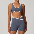 Woman modeling Blue-Grey Workout Outfit Fitness Sportswear with blue sports bra and biker shorts