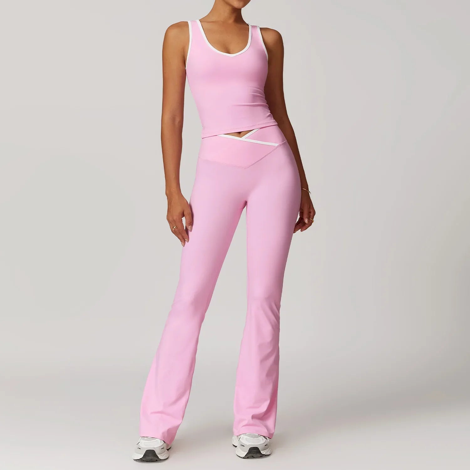 Pink two-piece workout outfit fitness sportswear with tank top and flared leggings