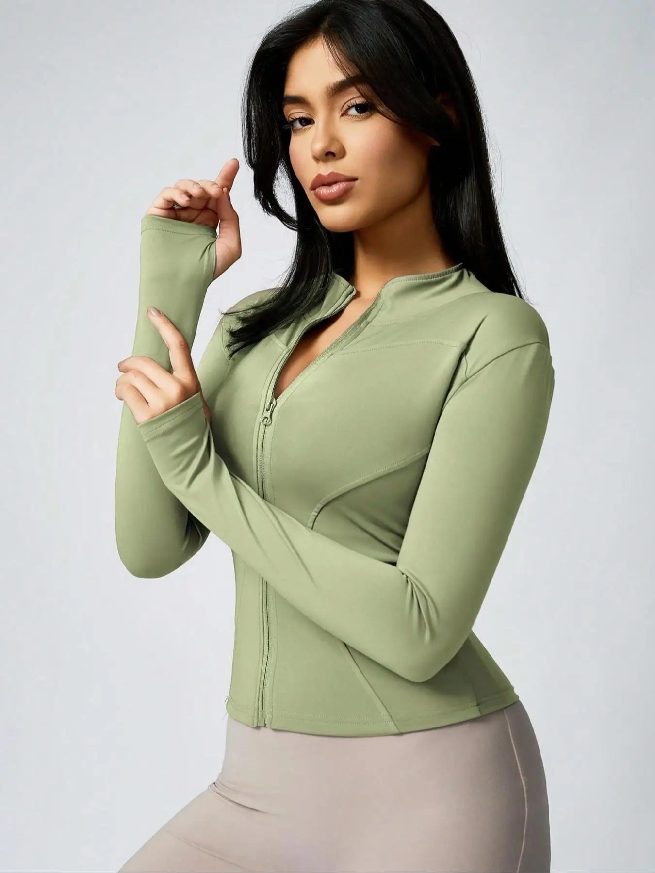 Brown cropped athletic jacket in light green with full-zip and thumbholes