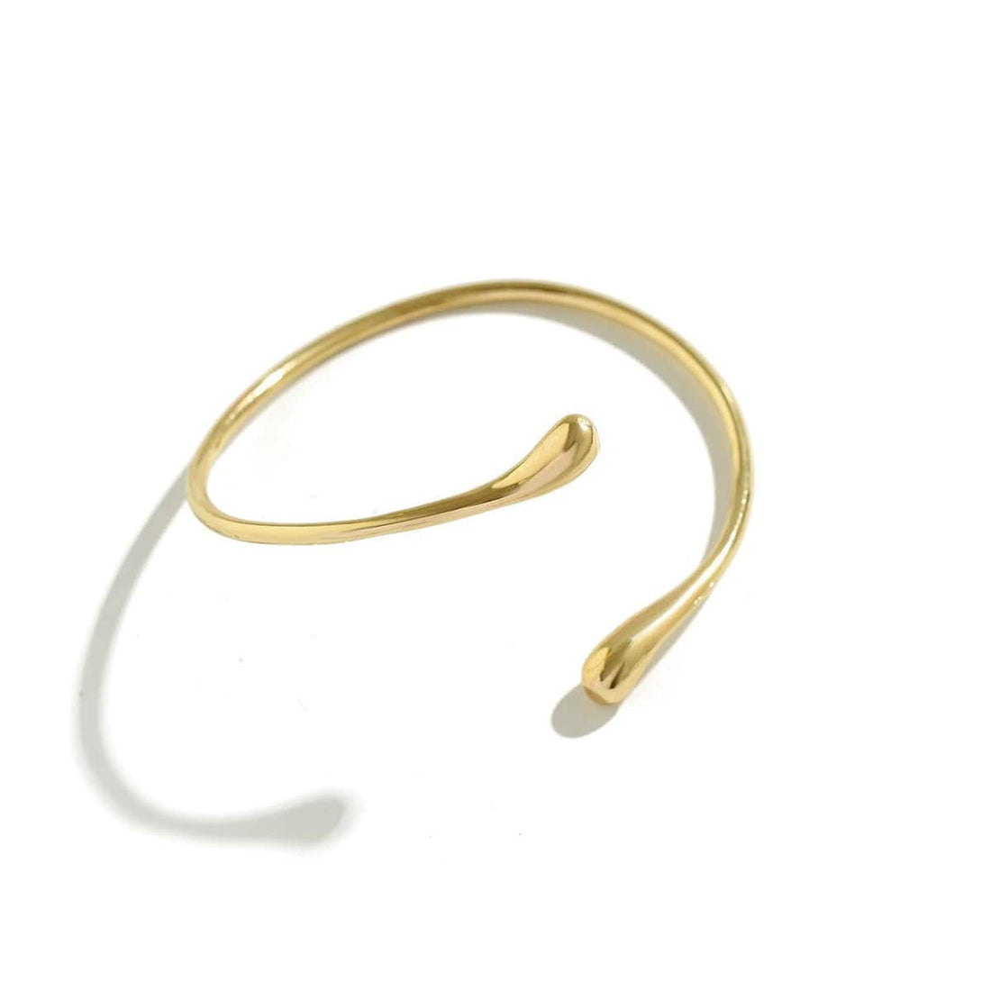 Handcrafted Gold-plated Geometric Cuff Bracelets And Boho-chic Metal Tassel Arm Rings With Vintage-inspired Exaggerated Water Drop Designs, Offering Unisex Luxury Accessories In Open Bangle Styles - Norellé