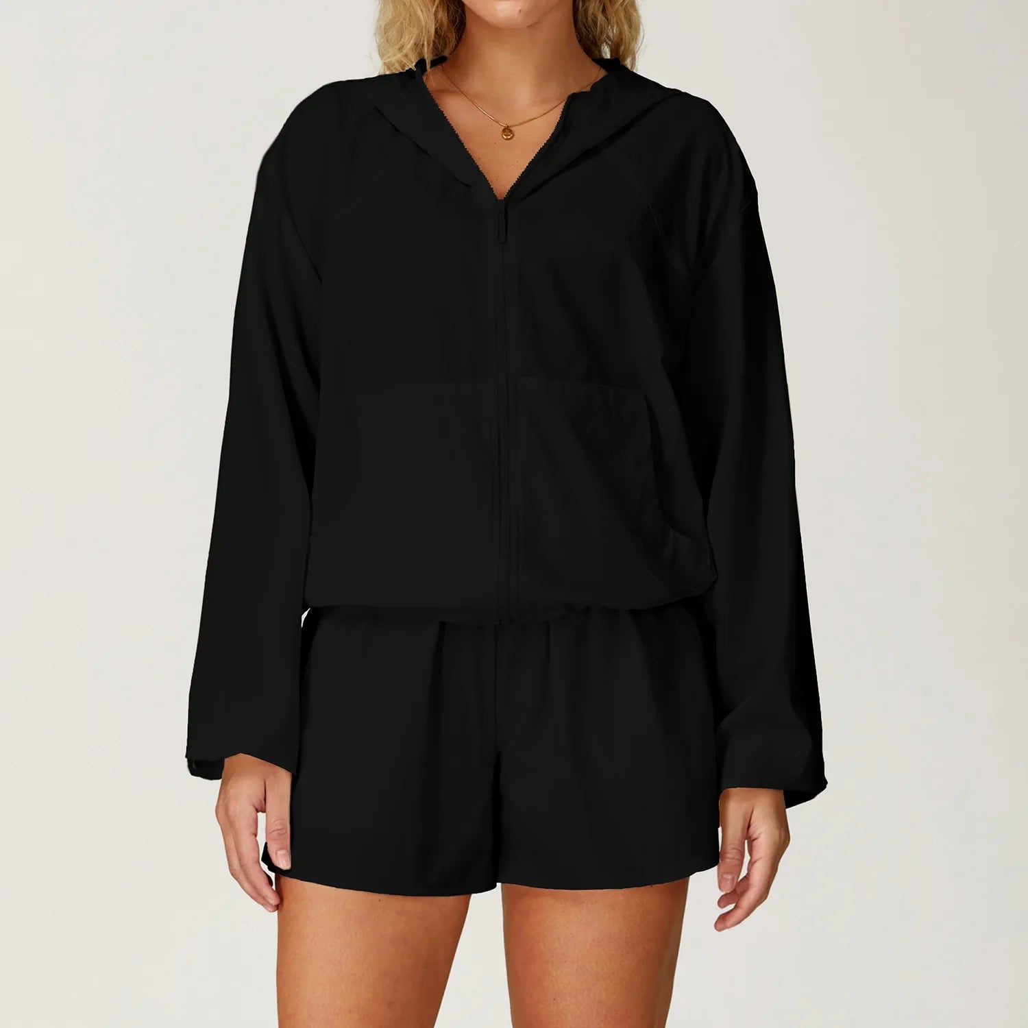 Black long-sleeved hooded top and matching shorts set for outdoor sports women