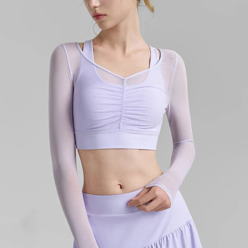 Light blue solid mesh long-sleeve sports top over sports bra