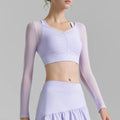 Athletic outfit featuring a lavender solid color mesh sports top with V neck and short sleeves
