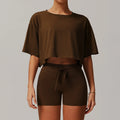 Women sportswear 2pcs set featuring a dark brown cropped top and fitted shorts for yoga