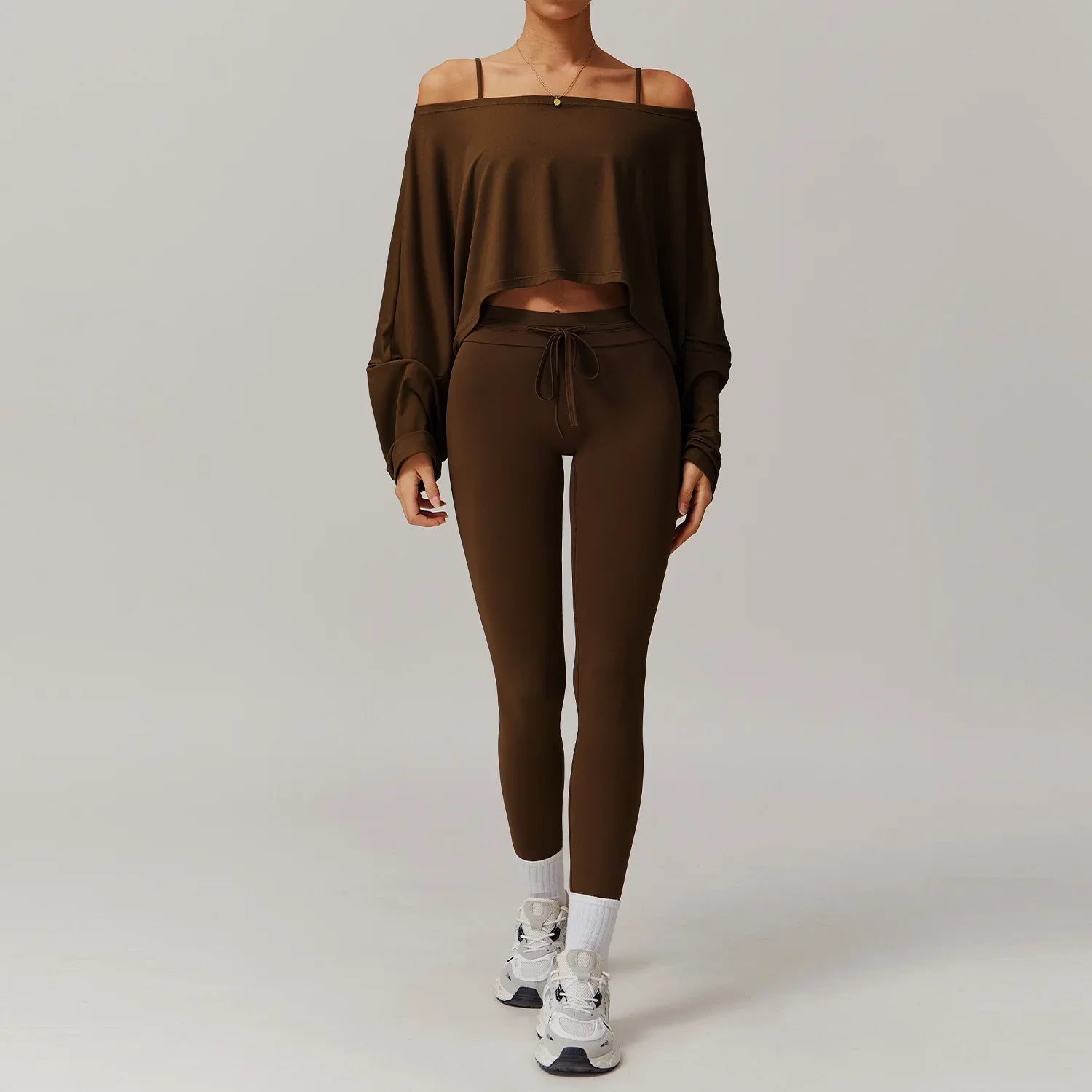 Women sportswear 2pcs set featuring dark brown off-the-shoulder crop top and leggings