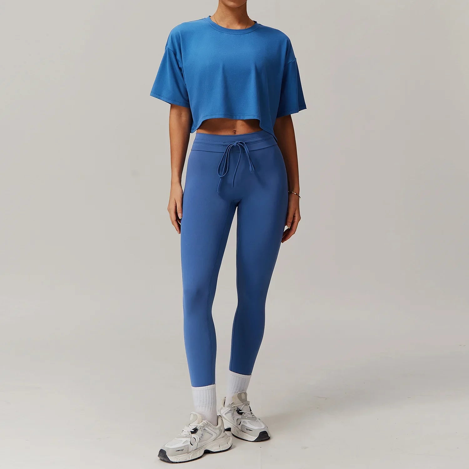 Woman wearing light blue sportswear 2pcs set, ideal for women tracksuit yoga and workouts