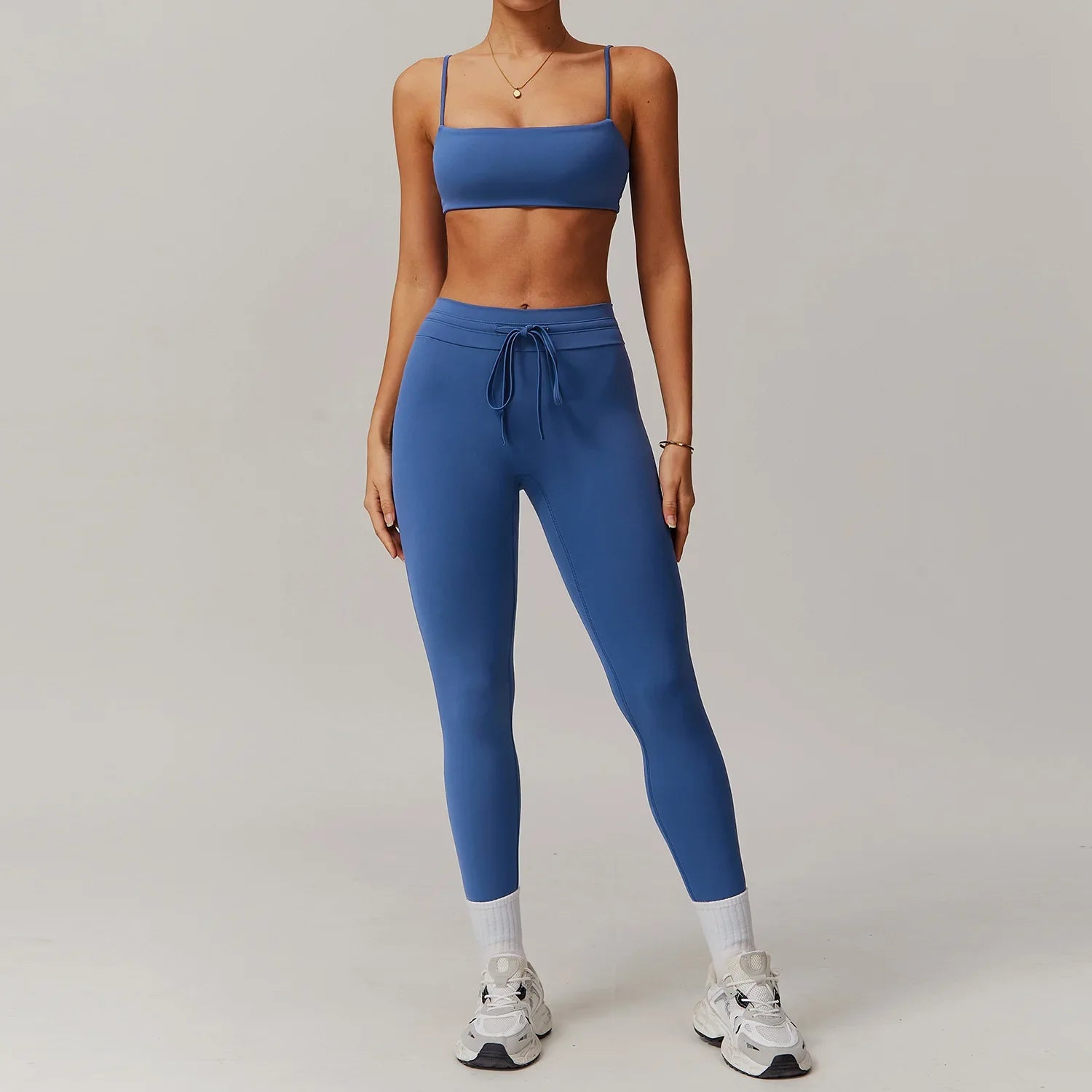 Image of a woman in light blue sportswear 2pcs set, ideal for women tracksuit yoga