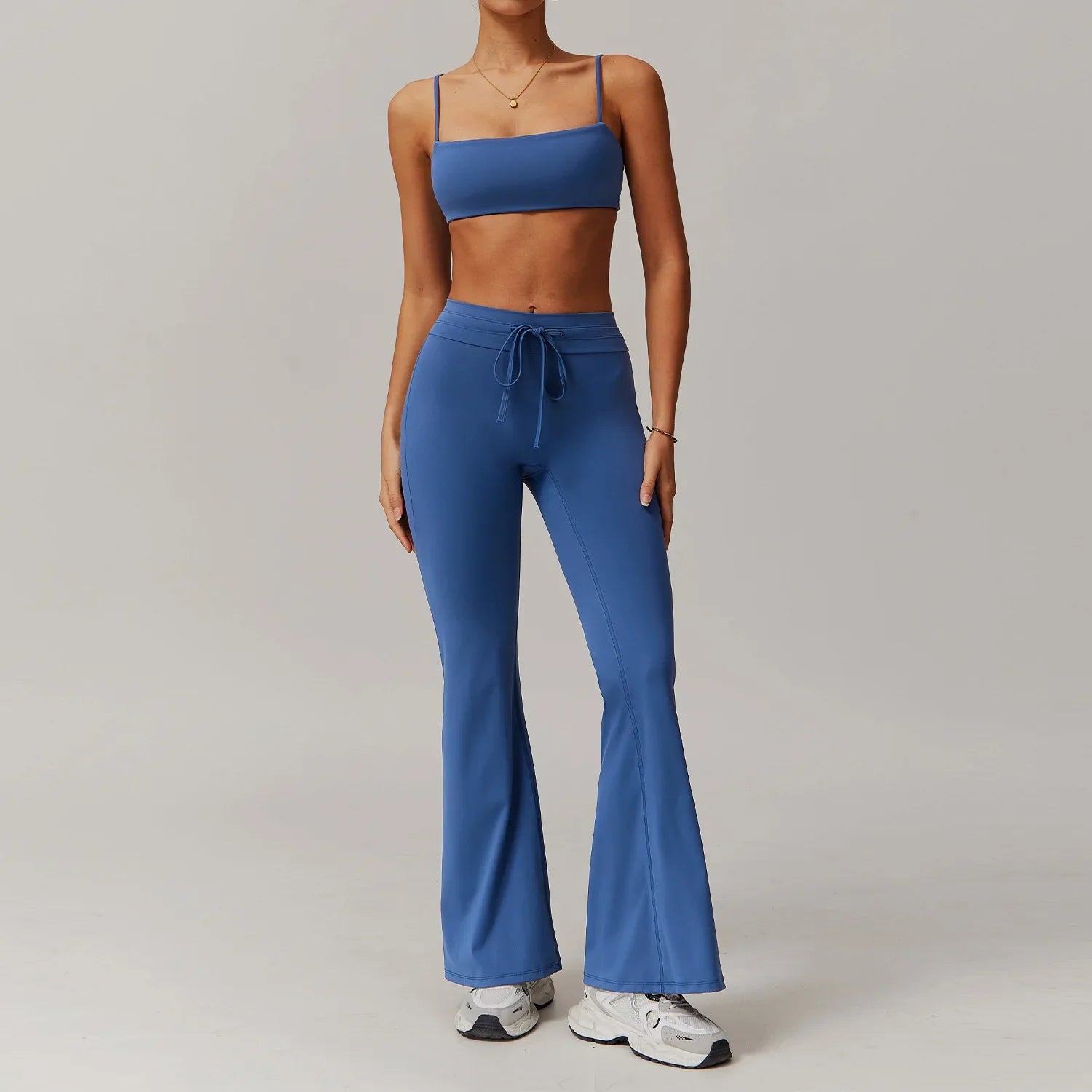 Light Blue womens sportswear 2pcs set featuring a strappy crop top and flared sweatpants