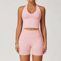 Light pink seamless gym set with halter crop top and biker shorts