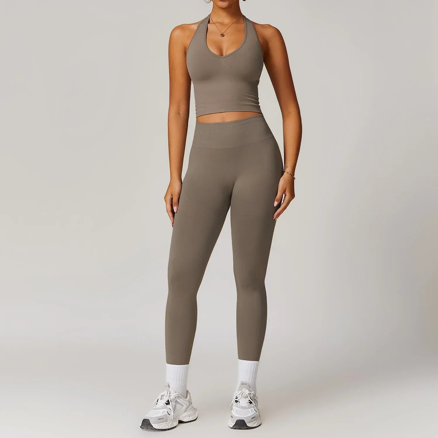 Light pink seamless gym set with olive green halter top and leggings