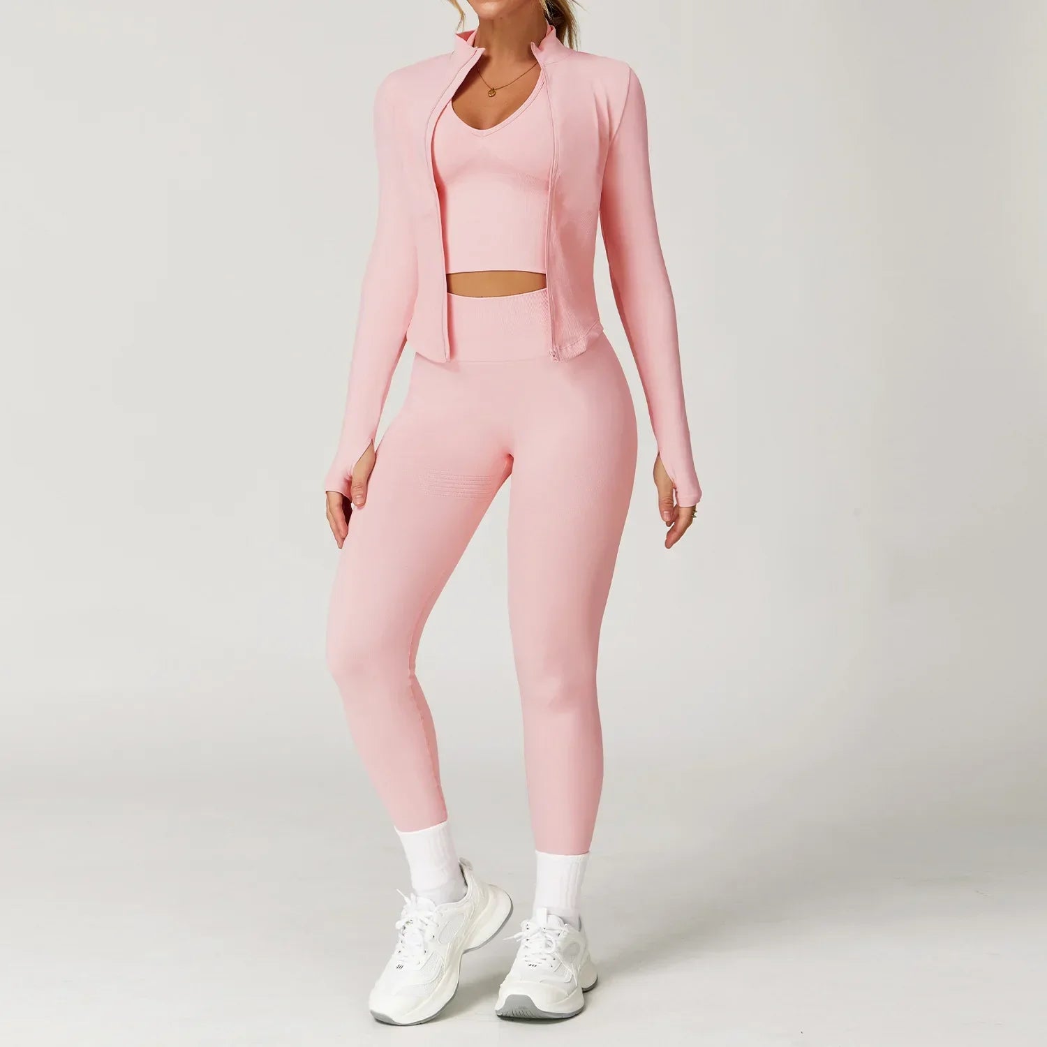 Light pink seamless gym set with jacket, bra, and leggings