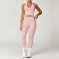 Light pink seamless gym set with halter crop top and high-waisted leggings