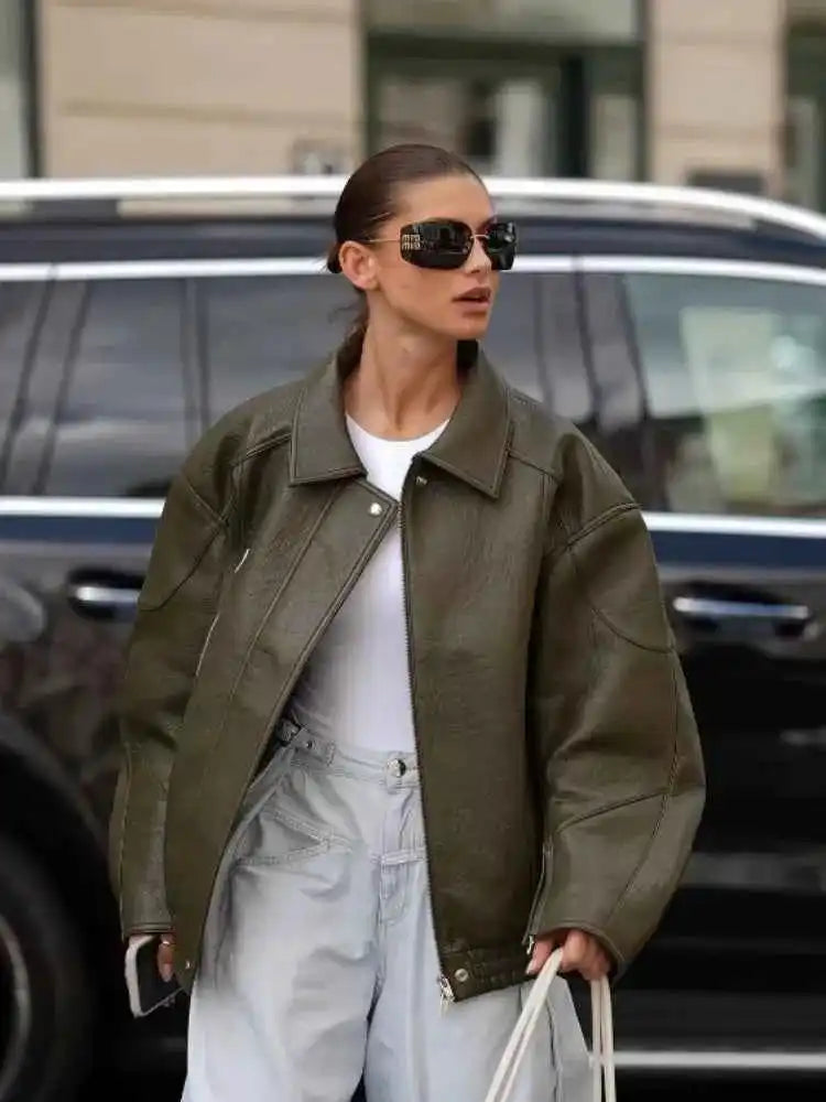 An olive green oversized leather jacket.