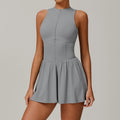 Plum sleeveless women yoga romper with cinched waist and pleated skirt