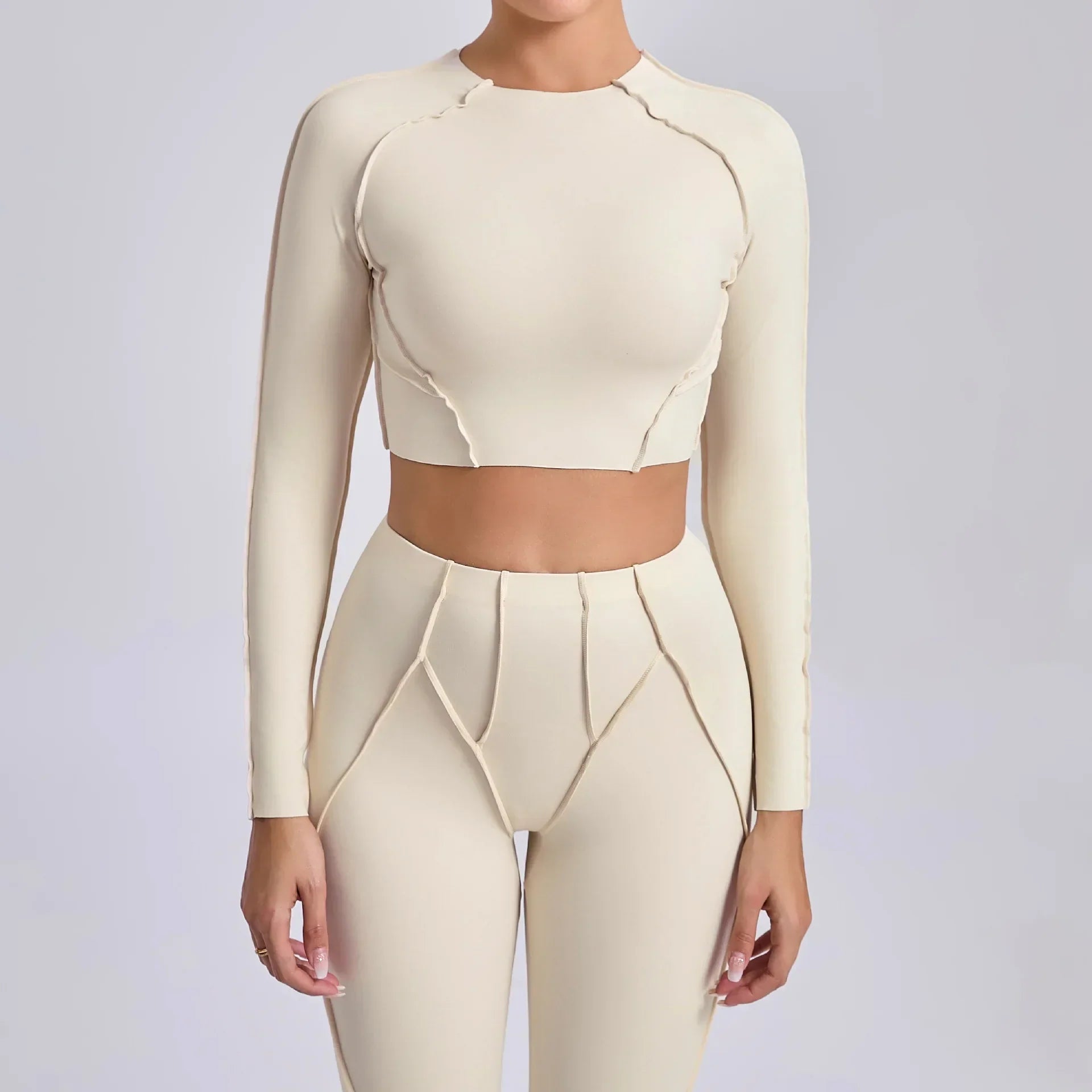 Light cream seamless yoga long sleeve cropped top with matching leggings