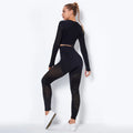 Woman in seamless yoga set: ribbed crop top and high-waisted leggings