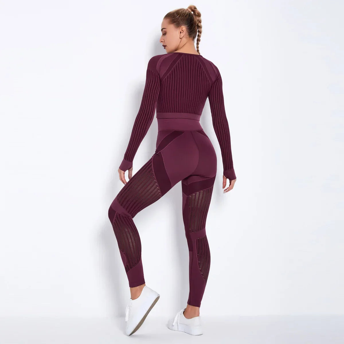 Woman in seamless yoga set with ribbed crop top and high-waisted leggings