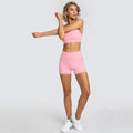 Woman in pink 2pcs yoga set gym suits for workouts