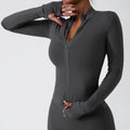 Dark gray long sleeve sports jacket with front zipper and thumbholes, ideal for yoga long sleeve workouts