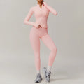 Light pink women’s athletic 2pcs sports set with zip-up top and high-waisted leggings